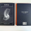 Portal hardcover journal by The Ei8ht, front and back cover displayed on a white background, with the Traveler journal partially visible behind it. B5 lined notebook with geometric artwork.