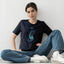 Woman wearing Portal Navy Organic Cotton T-Shirt with geometric cosmic design - Sustainable fashion by The Ei8ht.