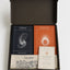 The Transition Set by The Ei8ht — open black gift box with Portal and Traveler journals, organic cotton tote, and The In-Between card.
